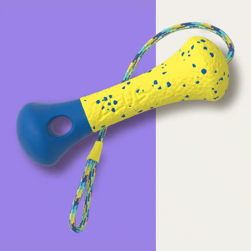 Zeus Nitro Weighted Buoy dog toy with rope, yellow & blue, on purple and white background.