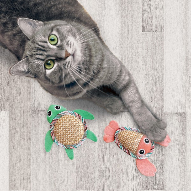 Gray tabby cat on floor with two Kong KONG Tropics Pals catnip toys nearby.