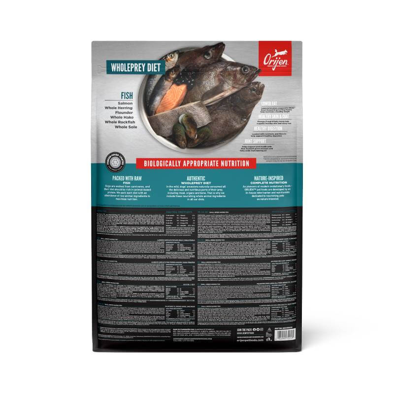 Orijen Small Breed Marine Fish dog food, with owner and pet by the water.