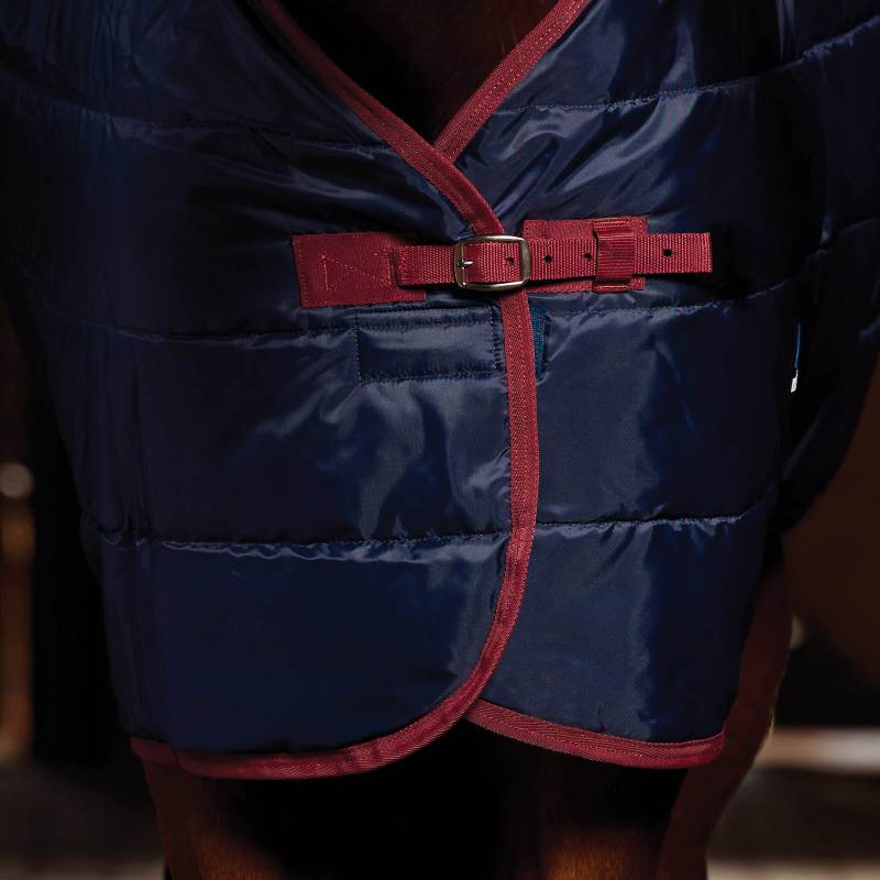 Weatherbeeta Comfitec 210D Channel Quilt Stable Rug 220g Navy/Burgundy on a horse’s chest.