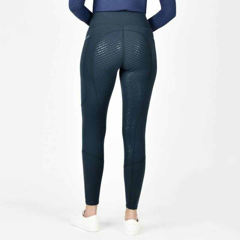 Person in Weatherbeeta Veda Technical Tights Pine, shown from the back on a plain background.