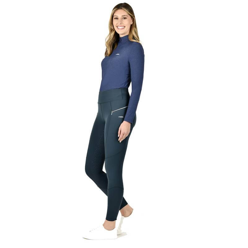 Woman in Weatherbeeta Veda Technical Tights Pine smiling against a white background.