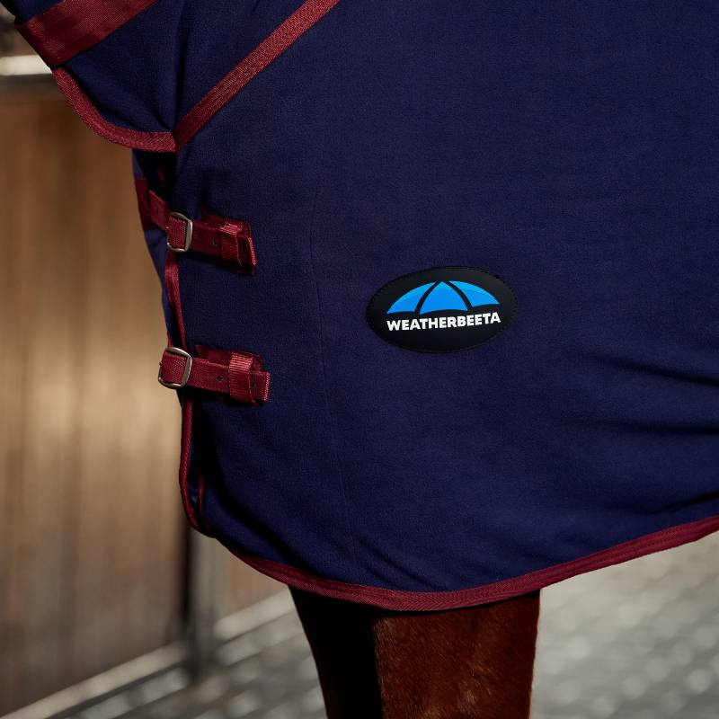 Close-up of Weatherbeeta Anti-Static Fleece Cooler Combo Neck in navy/burgundy.