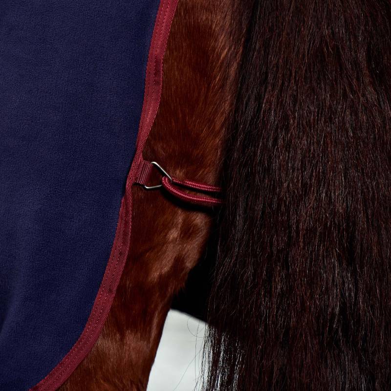 Close-up of a horse in the Weatherbeeta Anti-Static Fleece Cooler Combo Neck Navy/Burgundy blanket.