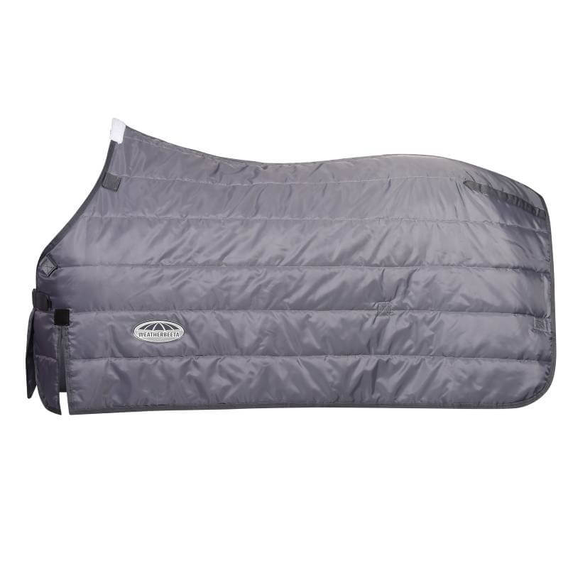 A brown horse in a Weatherbeeta Comfitec Thermi Heat Liner Stable Rug Grey 100g stands nearby.