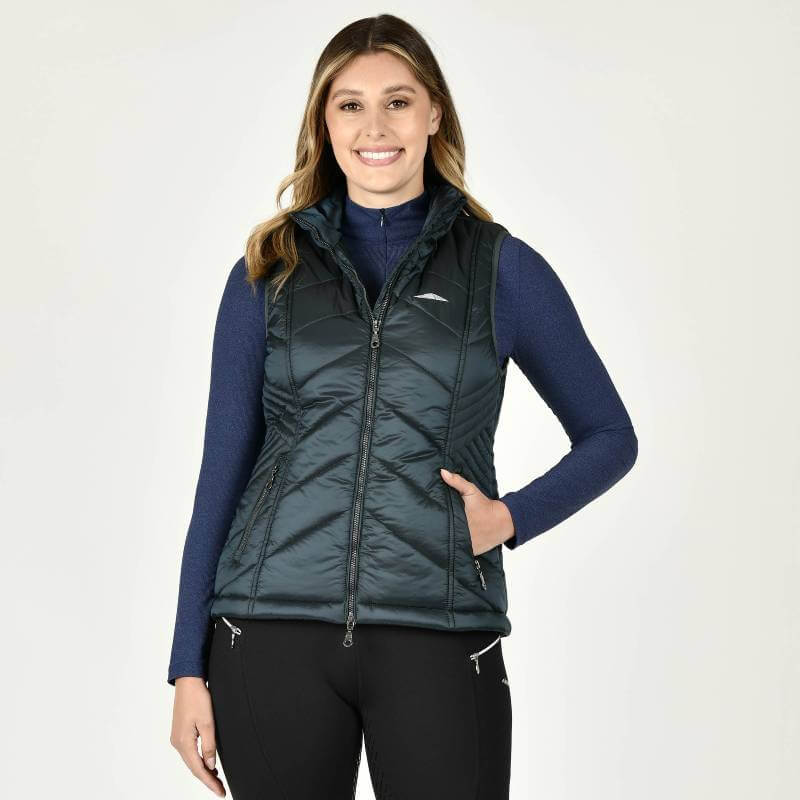 Woman in a Weatherbeeta Presley Puffer Vest Pine, smiling at the camera.