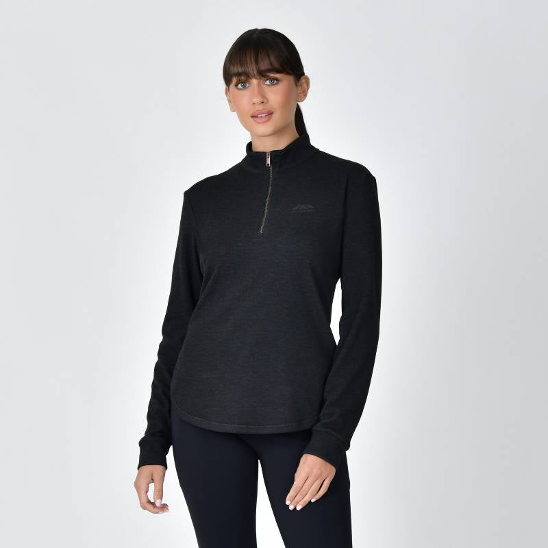 Woman in Weatherbeeta London Layer Long Sleeve Top Black Marle, arms crossed, plain background.