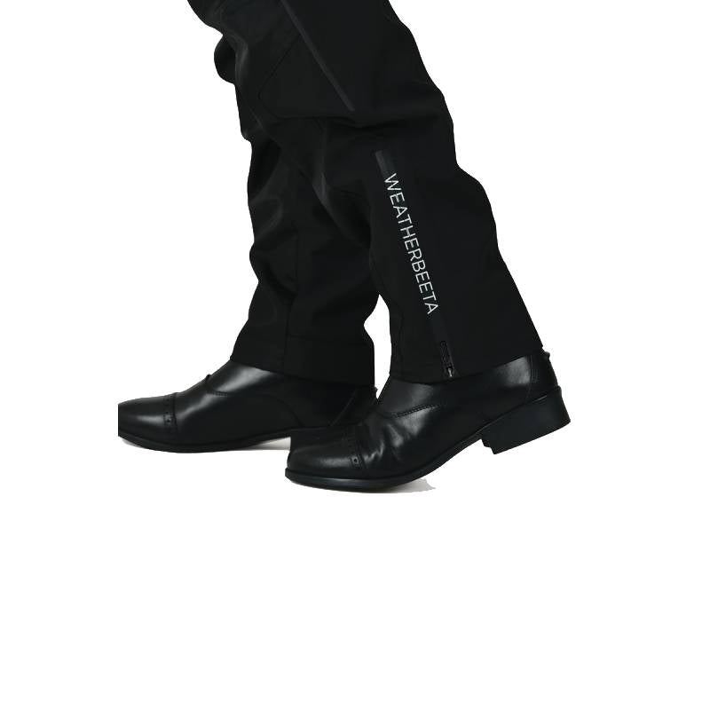 Wearing Weatherbeeta Rayne Waterproof Overtrousers II Black/White and black boots.