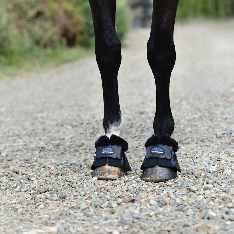 Weatherbeeta Tough-Tec Impact Bell Boots protect horse hooves on gravel paths.