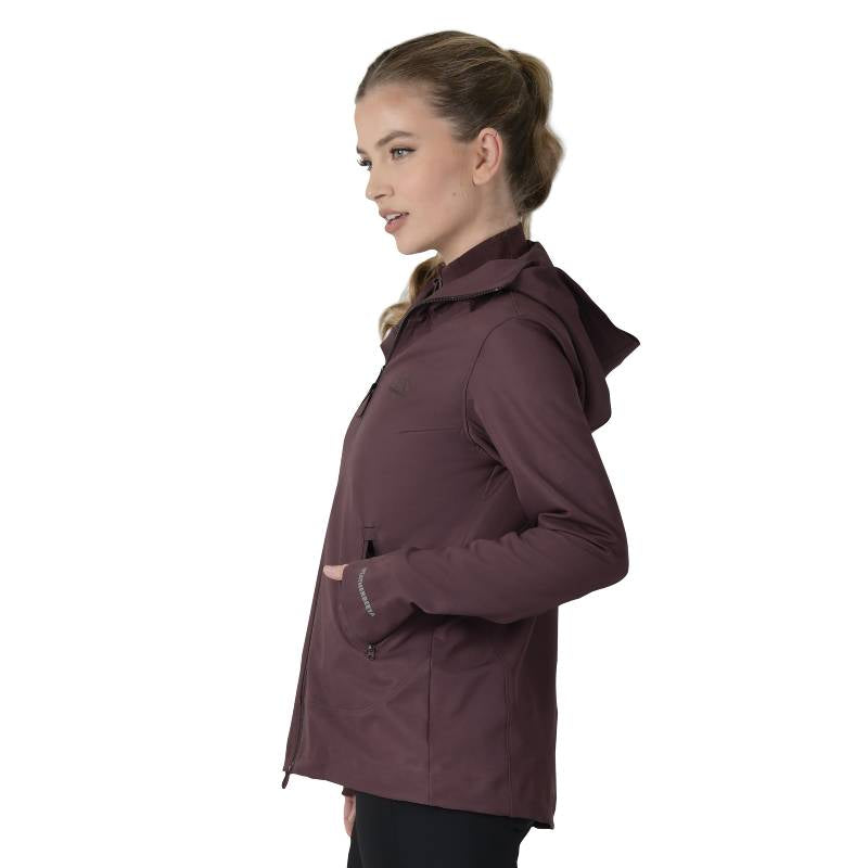 Woman in Weatherbeeta Abrasion Proof Stretch Riding Jacket Mulberry stands in profile.