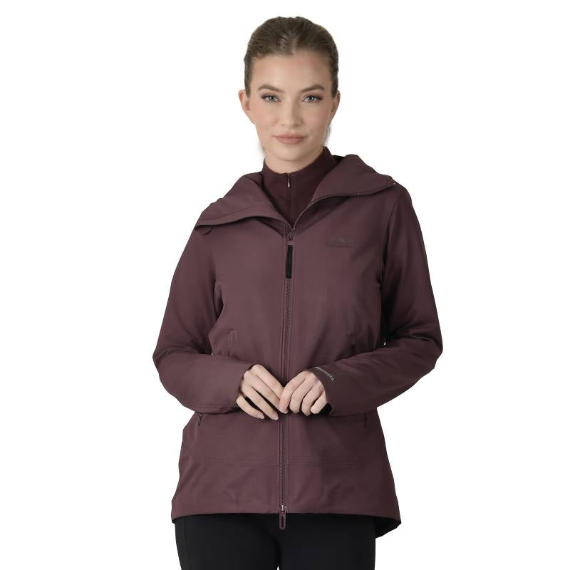 Woman in a Weatherbeeta Abrasion Proof Stretch Riding Jacket Mulberry stands, facing forward.