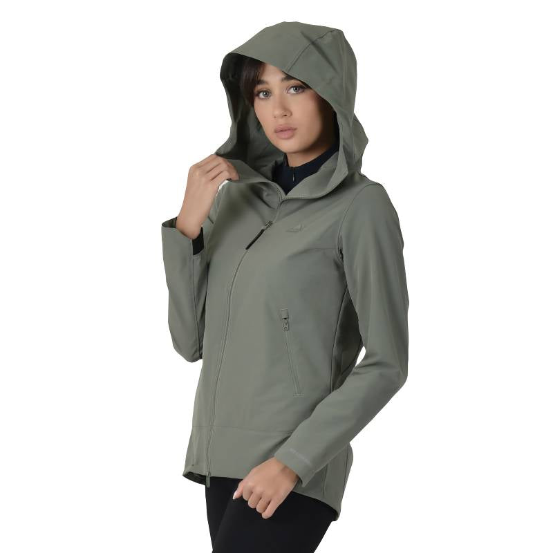 Woman in olive Weatherbeeta jacket adjusts hood while looking at the camera.