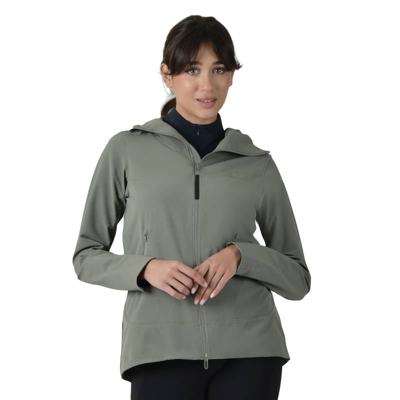 Woman wearing a Weatherbeeta Olive Leaf Stretch Riding Jacket stands against a white background.
