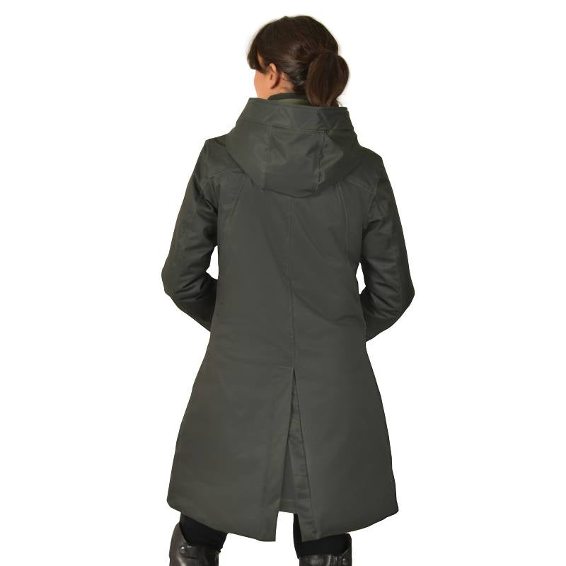 Woman wears Weatherbeeta All Purpose Waterproof Longline Equestrian Jacket in Midnight Green.