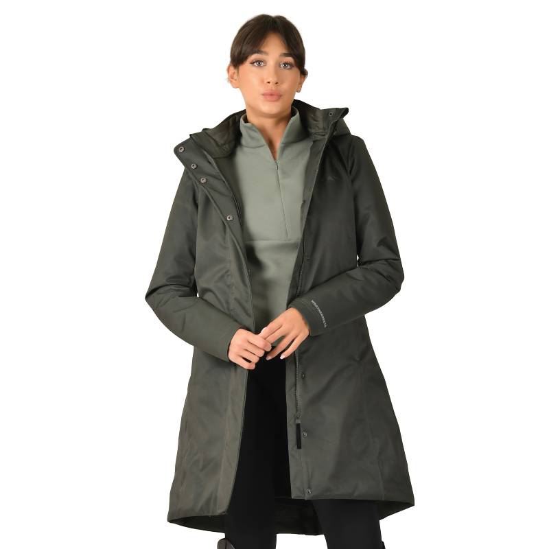 Woman in a Weatherbeeta Midnight Green All Purpose Waterproof Longline Equestrian Jacket.