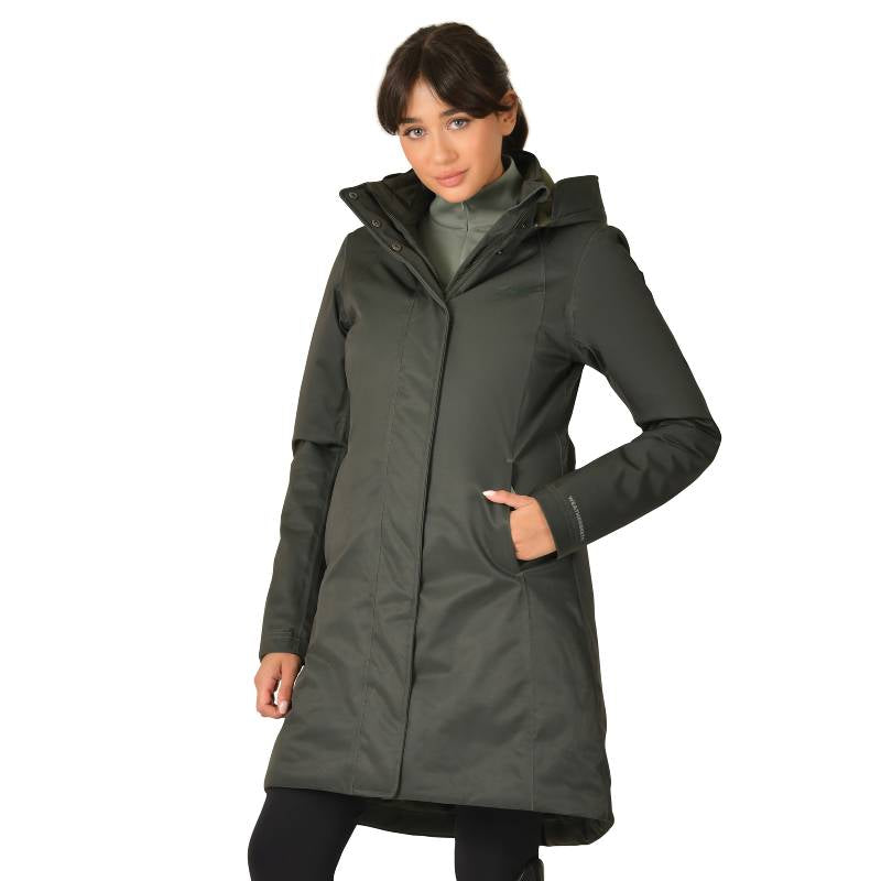 Woman wears Weatherbeeta All Purpose Waterproof Longline Equestrian Jacket in Midnight Green.