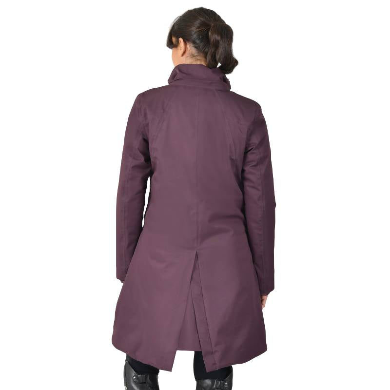 Woman wears Weatherbeeta All Purpose Mulberry Longline Equestrian Jacket, back to camera.