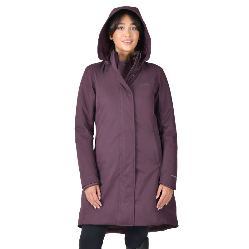 Woman wearing a Weatherbeeta Mulberry Longline Equestrian Jacket with hood, smiling.