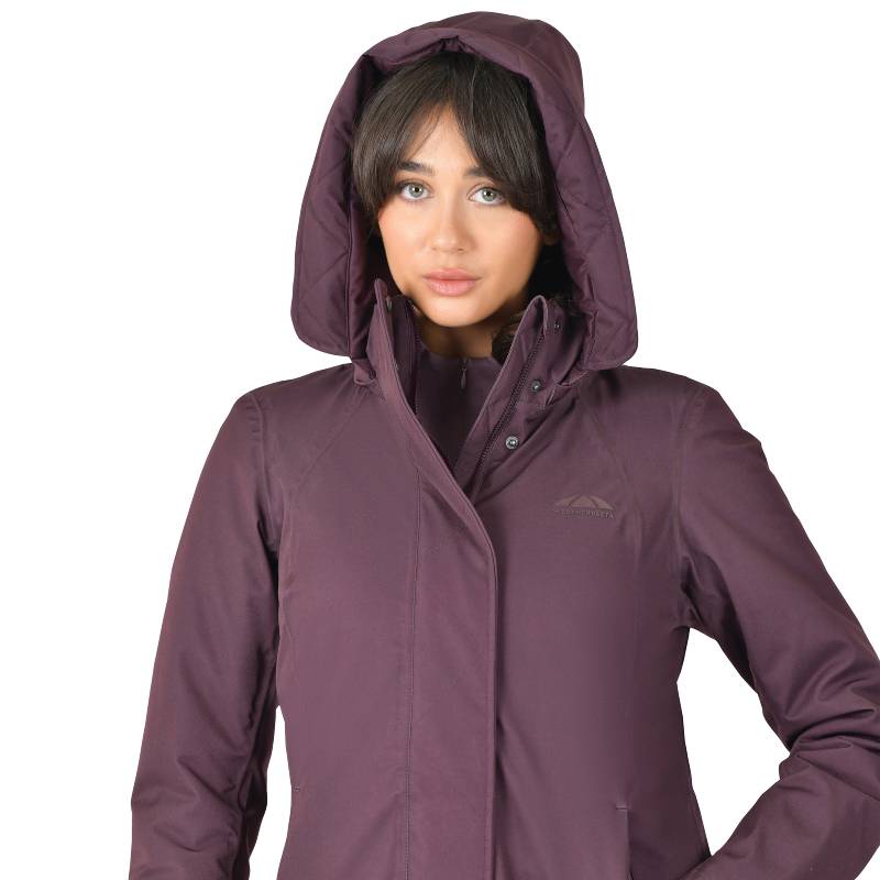Woman in a mulberry Weatherbeeta All Purpose Waterproof Longline Equestrian Jacket.