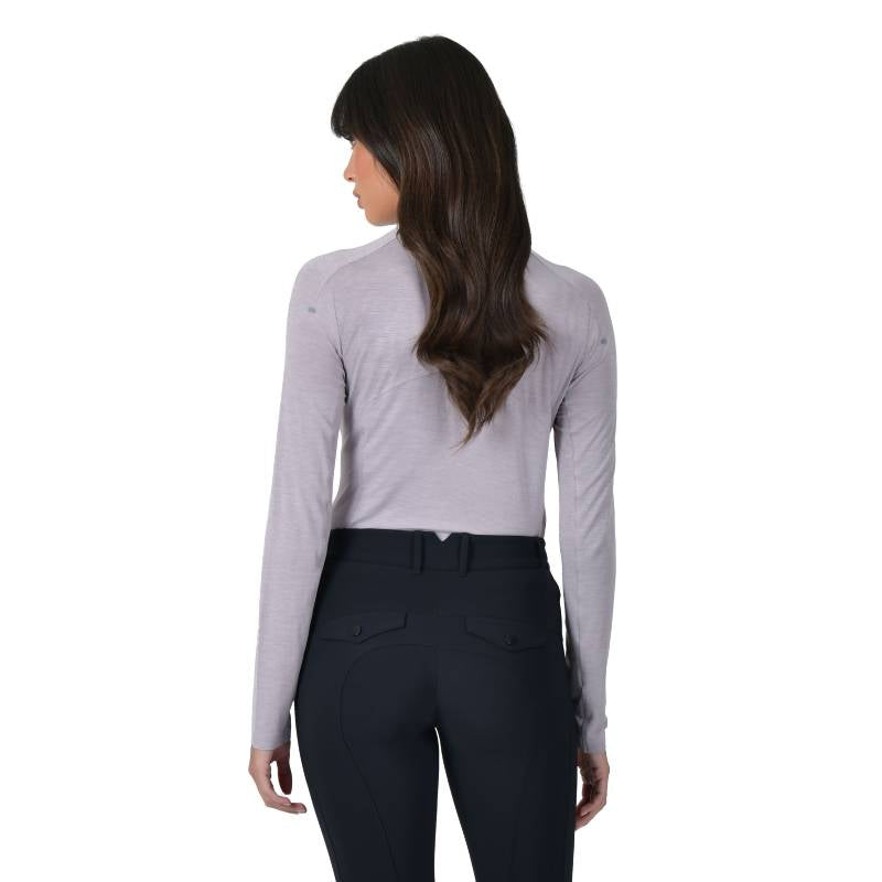 Woman with long brown hair seen from behind in Weatherbeeta Bamboo Burnished Lilac base layer.