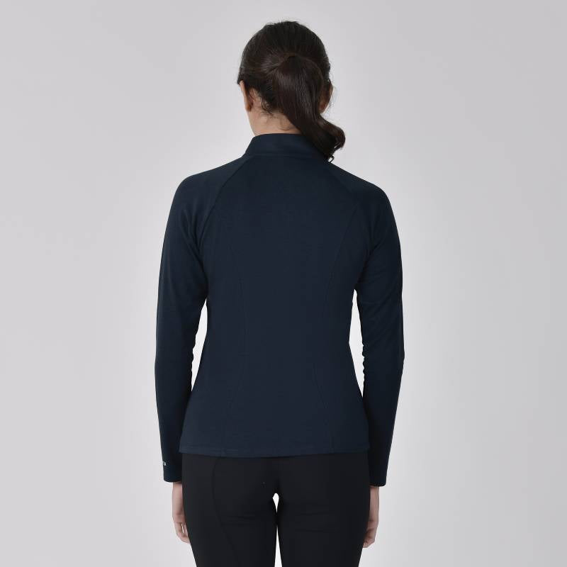 Woman with dark ponytail wears Weatherbeeta Bamboo Long Sleeve Base Layer Navy, shown from the back.