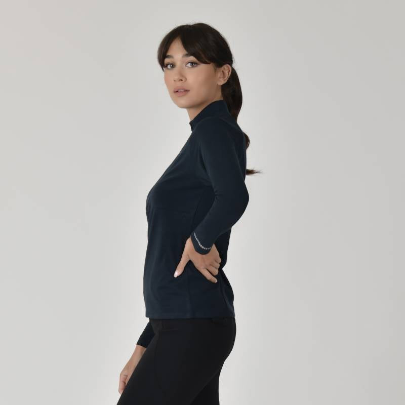 Woman wears Weatherbeeta Bamboo Navy Base Layer, standing sideways against a plain background.