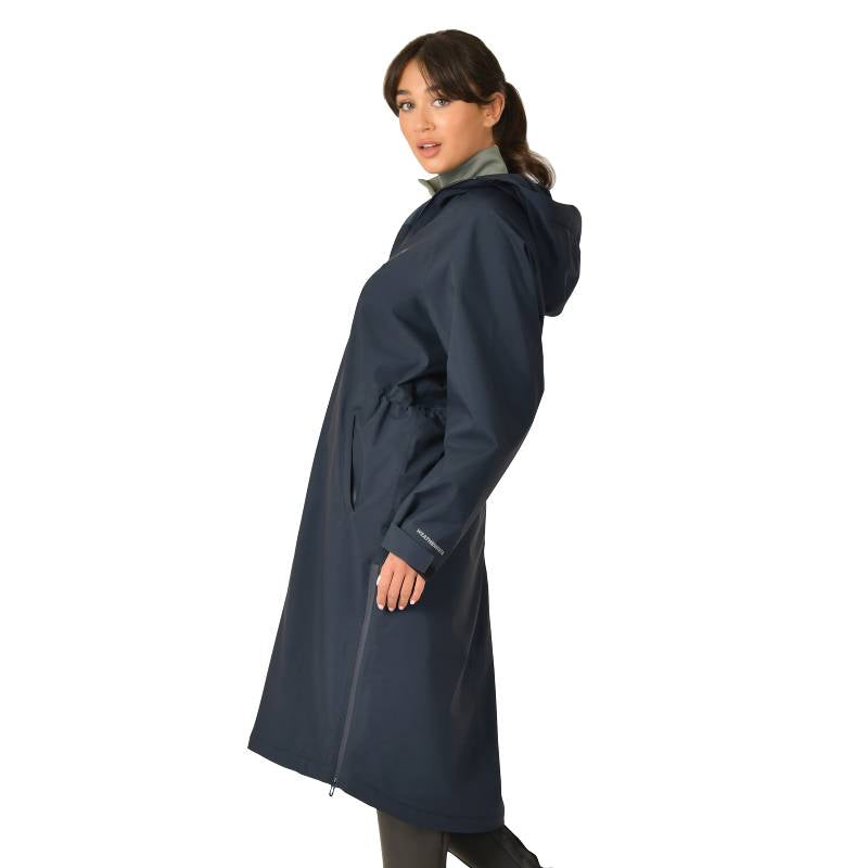 Woman wearing Weatherbeeta All Weather Field Jacket Navy, standing sideways against white background.