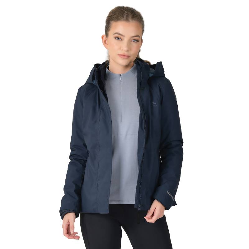 Woman in Weatherbeeta Protect Jacket With High Neck Navy, over a light gray top, on white backdrop.
