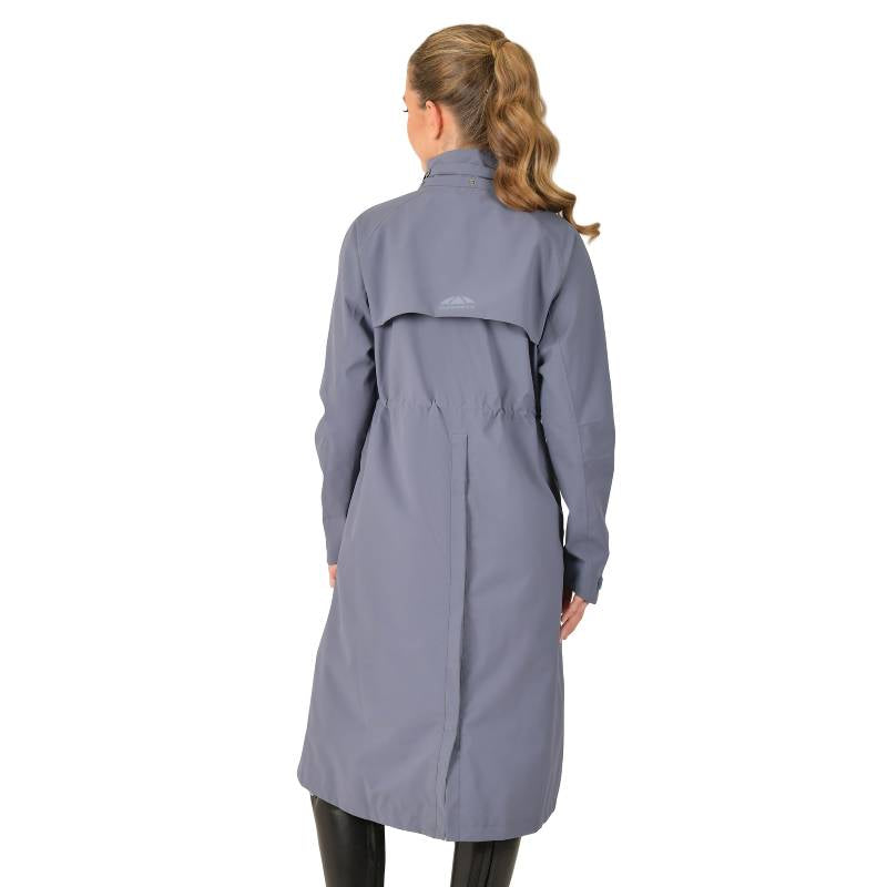 Woman in a Weatherbeeta Windbreaker Longline Riding Jacket Slate Blue with hands in pockets.