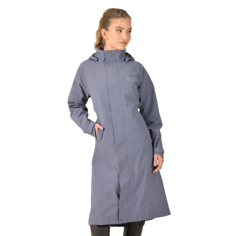 Woman in a Weatherbeeta Windbreaker Longline Riding Jacket Slate Blue with hands in pockets.