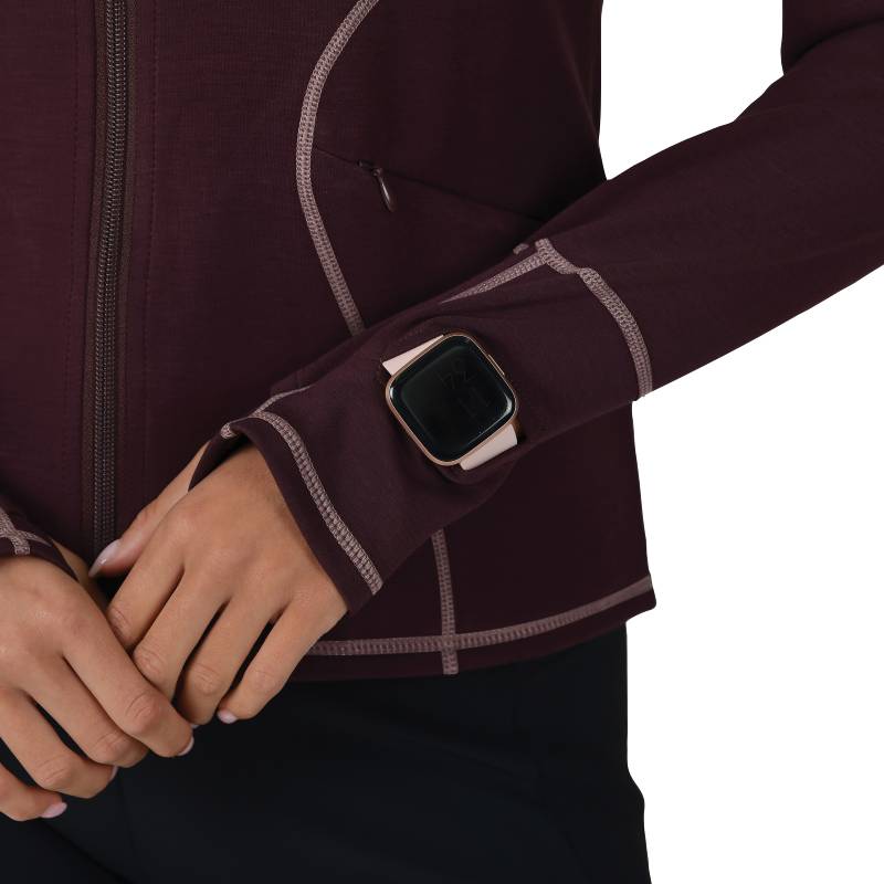 Woman in a Weatherbeeta Copper Performance Jacket Mulberry stands against a white background.