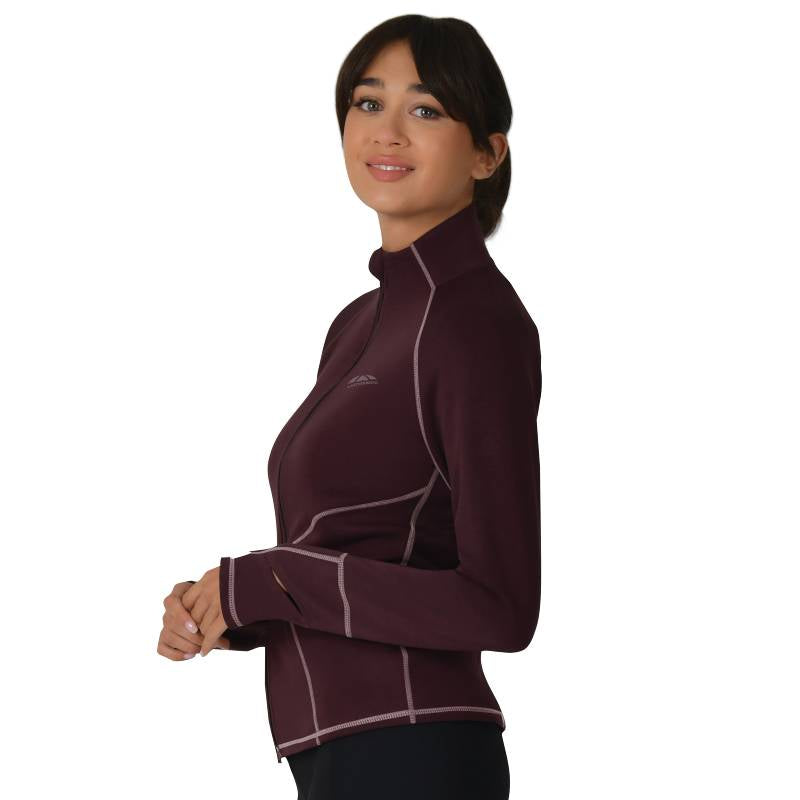 Woman in a Weatherbeeta Copper Performance Jacket Mulberry, smiling at the camera.