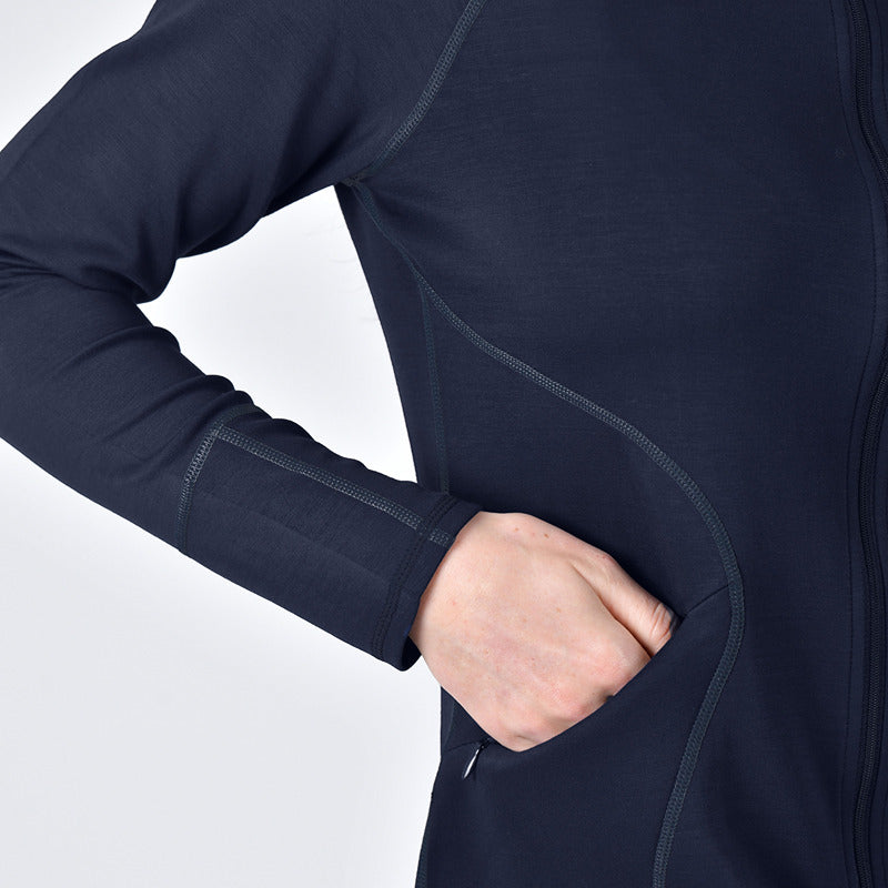 Wearing a Weatherbeeta Copper Performance Jacket Navy with one hand in its zippered pocket.