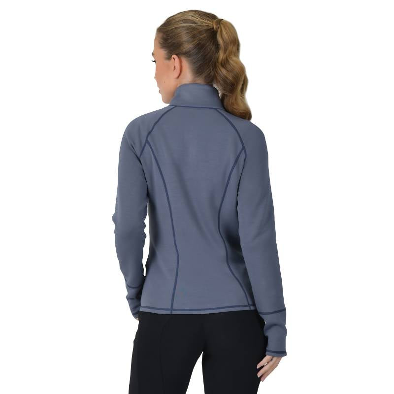 Woman with a ponytail in a Weatherbeeta Copper Performance Jacket Slate Blue and black pants, back view.