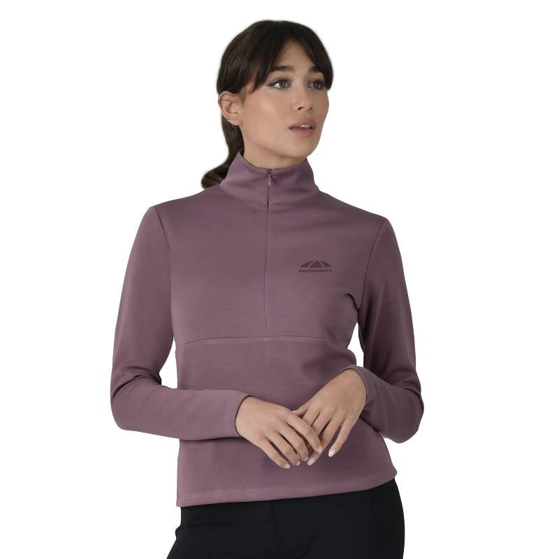 Woman in Weatherbeeta mauve wine 1/2 zip long sleeve mid-layer, white background.