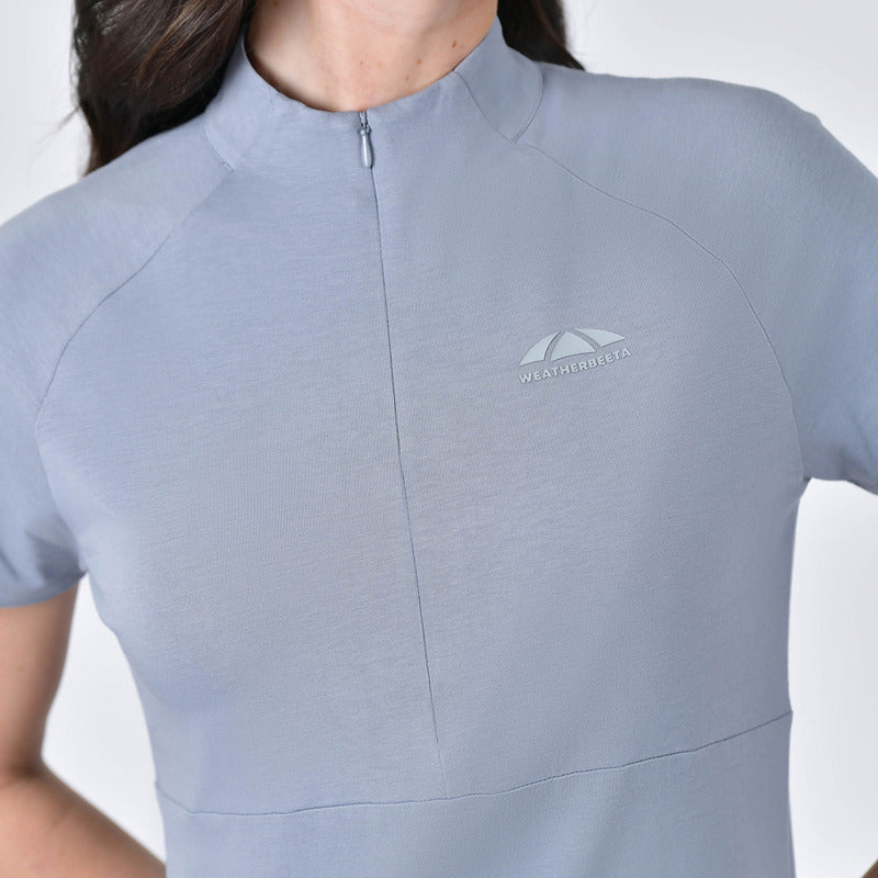 Woman in blue stone Weatherbeeta Bamboo Short Sleeve Performance Base Layer, upper body view.