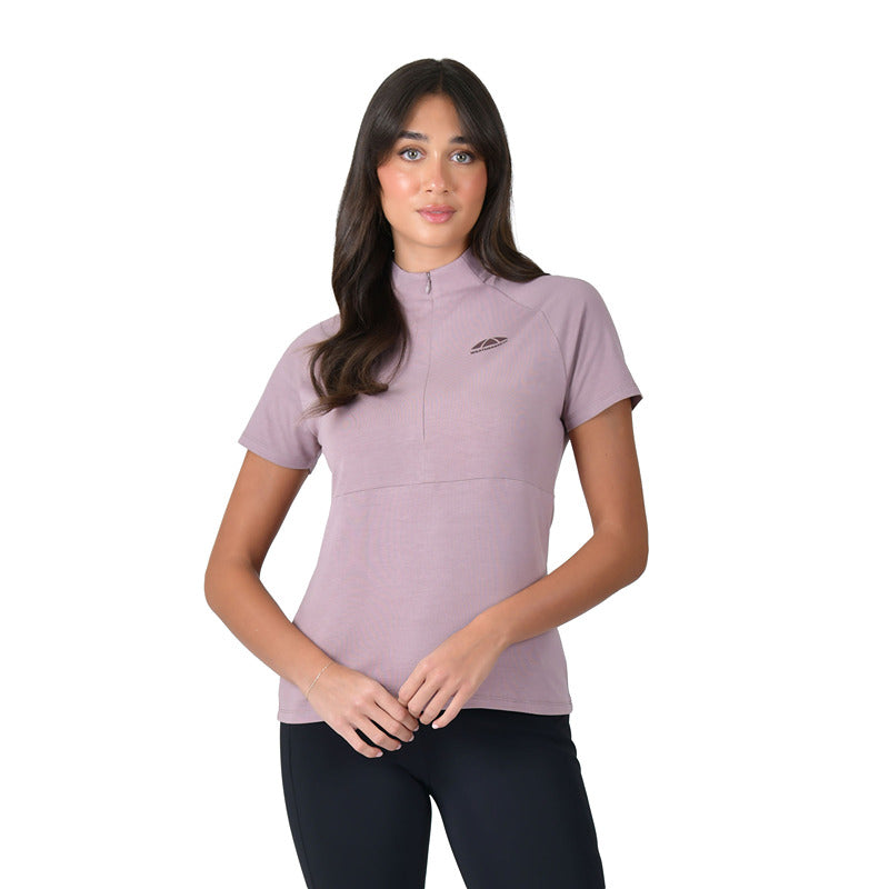 Woman wears Weatherbeeta Bamboo Base Layer Burnished Lilac and black pants, white background.