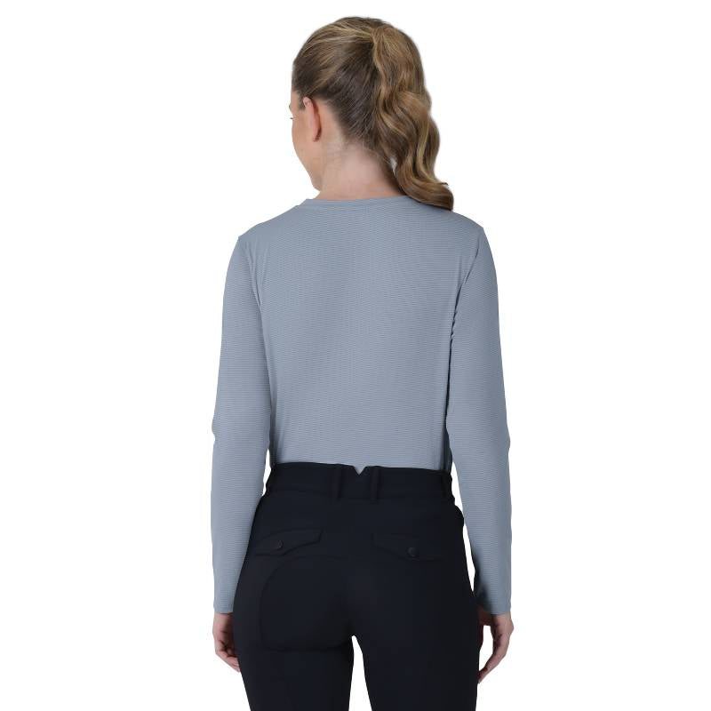 Woman in a Weatherbeeta Relaxed UV Long Sleeve Tee Blue Stone stands against a white background.
