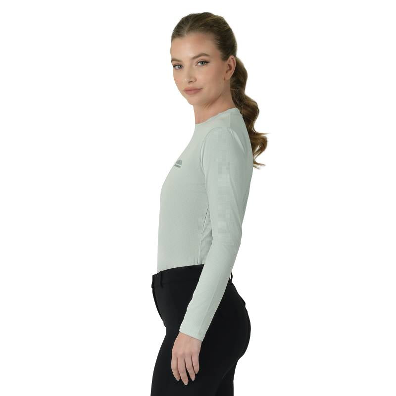 Woman in a Weatherbeeta Relaxed UV Long Sleeve Tee in Soft Sage, in profile on white background.