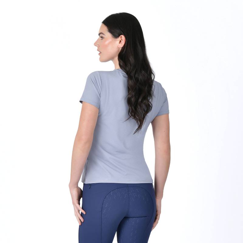 Woman in a Weatherbeeta Relaxed UV Short Sleeve Tee Blue Stone, with long dark hair, standing.