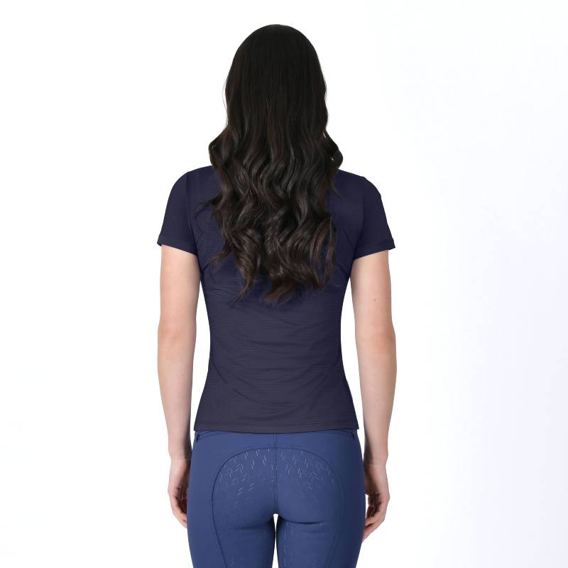 Woman with long wavy hair in a Weatherbeeta Relaxed UV Tee Navy and blue pants, back view.