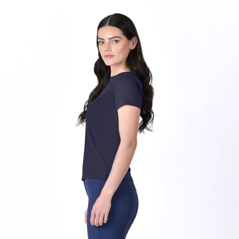 Woman with long dark hair wearing a Weatherbeeta Relaxed UV Tee Navy, standing against white background.
