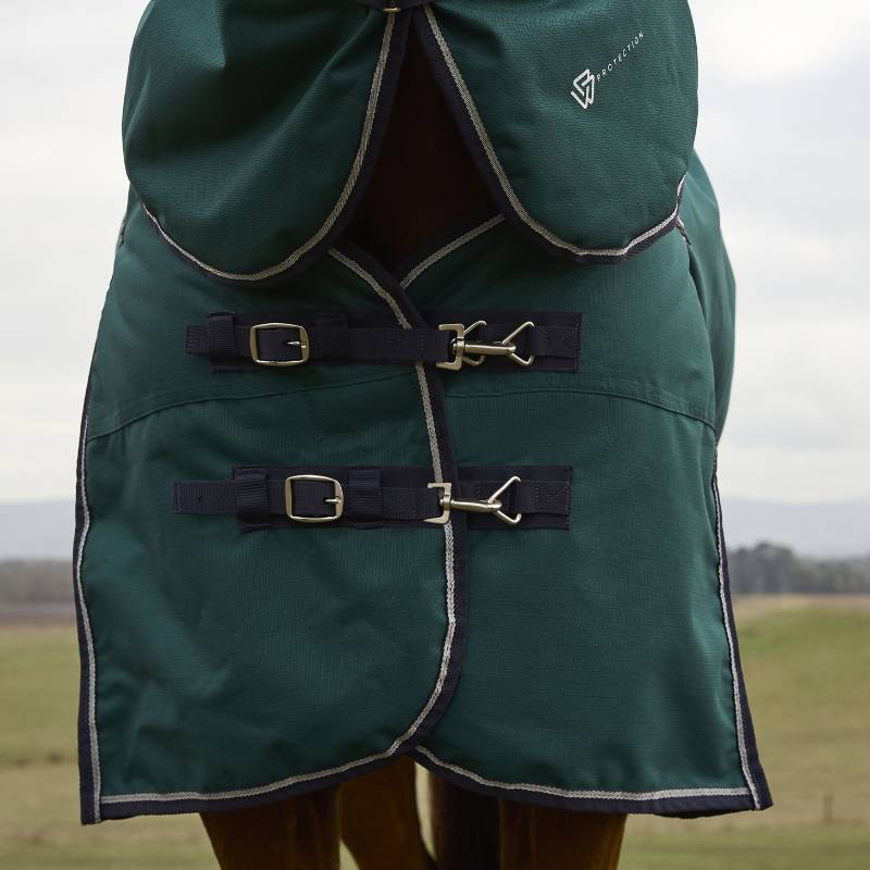 Close-up of Weatherbeeta Comfitec Plus Dynamic turnout rug, 100g, with buckles outdoors.