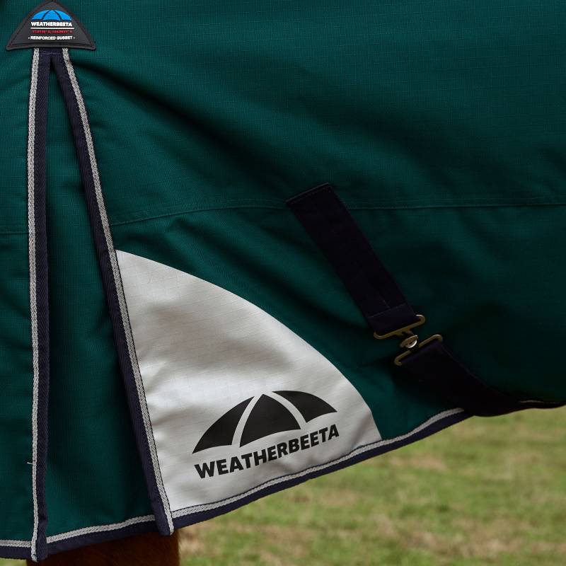 Close-up of a Weatherbeeta Comfitec Plus Dynamic 100g Forest Green/Navy turnout rug on a horse.