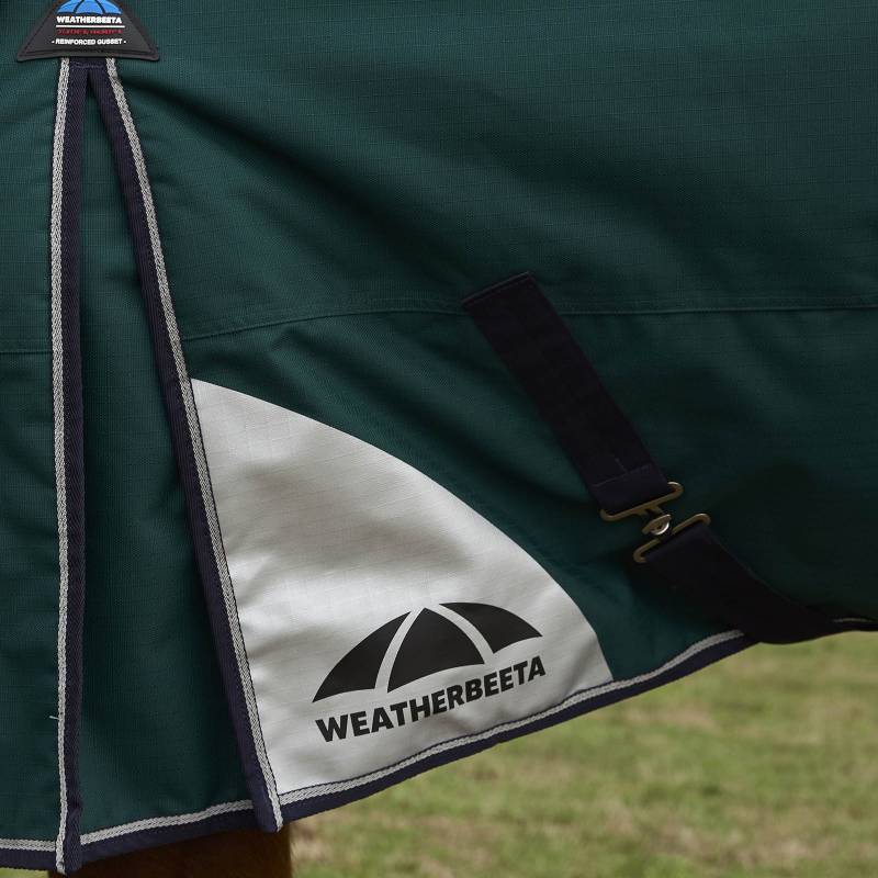 Close-up of Weatherbeeta Comfitec Plus Dynamic turnout rug in forest green/navy, 100g.