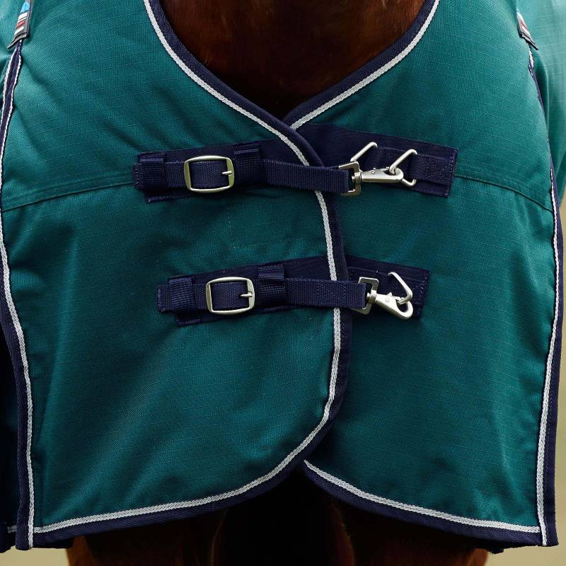 Close-up of a Weatherbeeta Comfitec Plus Light Rug in Forest Green/Navy with buckles and straps.