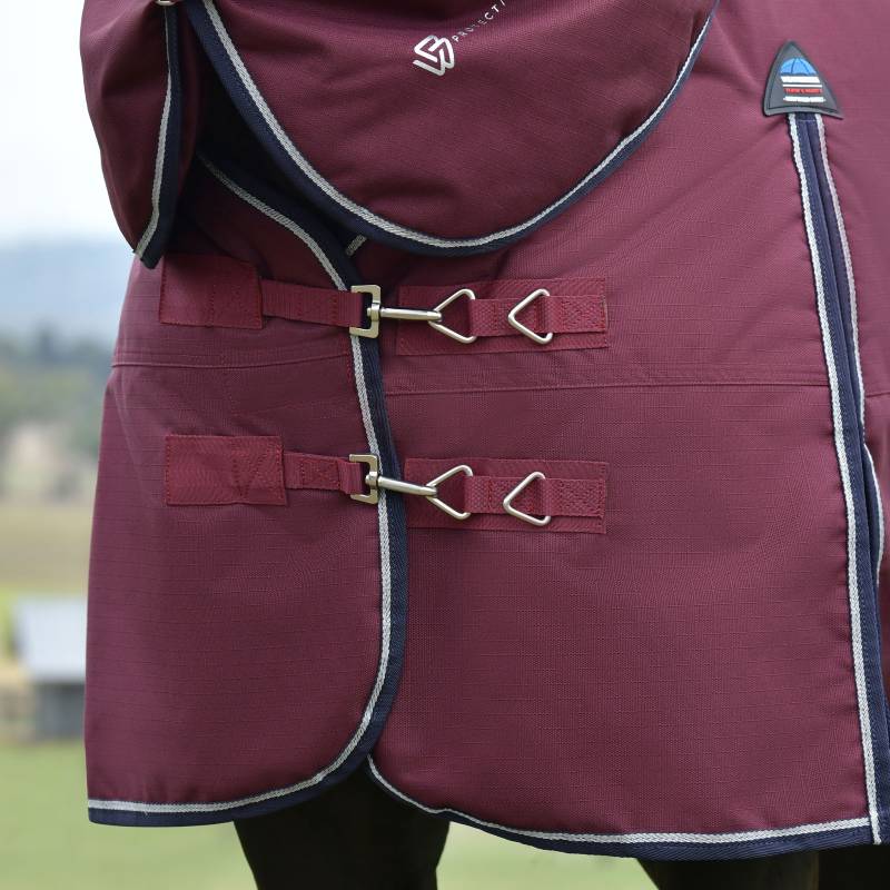 Close-up of Weatherbeeta Comfitec Essential Turnout Rug 220g in Burgundy/Navy on horse’s chest.