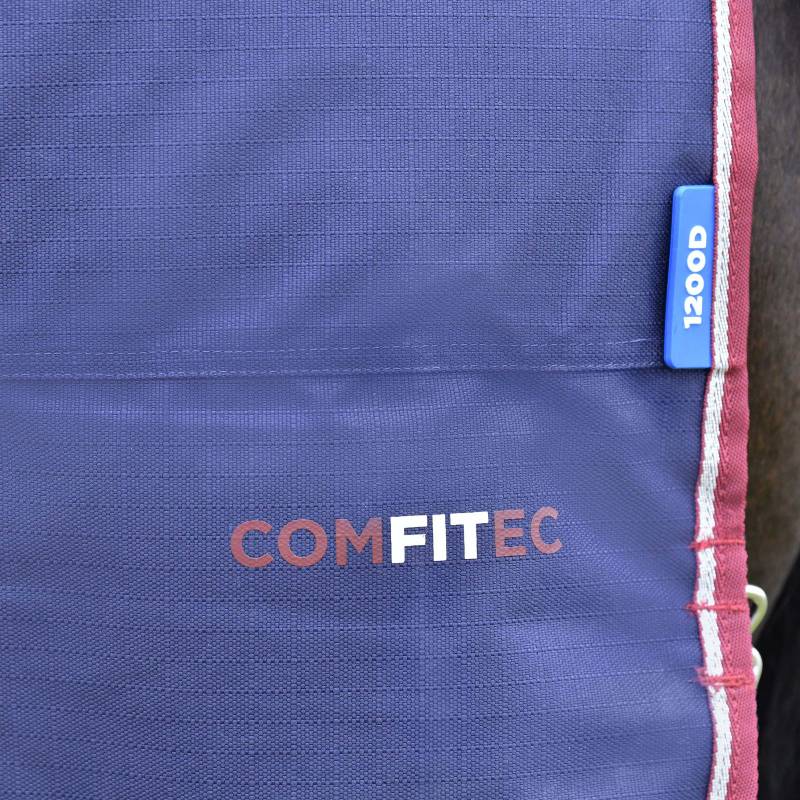 Close-up of Weatherbeeta Comfitec Essential Turnout Rug 220g in navy and burgundy trim.