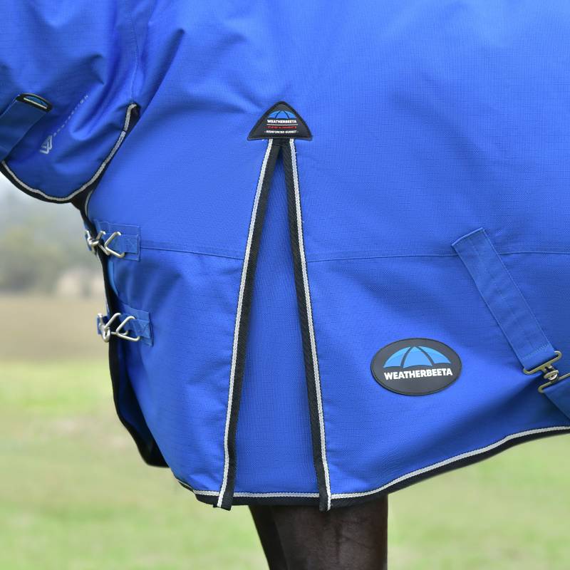 Close-up of a blue Weatherbeeta Comfitec Essential Combo Neck 220g rug with visible straps.
