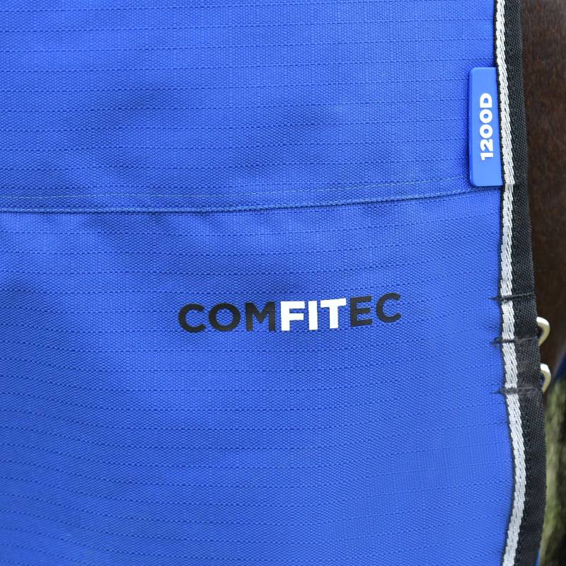 Close-up of Weatherbeeta Comfitec Essential 220g Cobalt/Black turnout rug with labels visible.